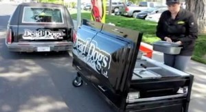 Vendor sells hots out of a hearse and coffin, video still (© Karen T Boucher/2012 Bay Area News Group, http://aka.ms/deaddogs)